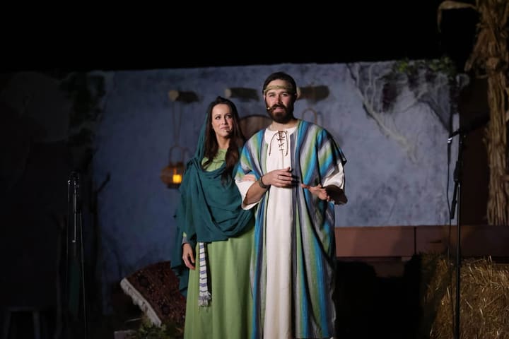 Mary and Joseph, played by volunteers, on the nativity stage.